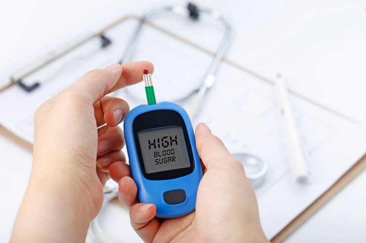 hand-holding-blood-glucose-meter-measuring-blood-sugar-background-is-stethoscope